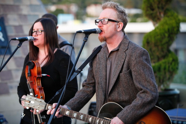 HOLLYWOOD, CA - MARCH 08: Bridget Regan (L) and Dave King of Flogging Molly perform at 98.7 FM's Penthouse Party Pad at The Historic Hollywood Tower on March 8, 2012 in Hollywood, California. (Photo by Imeh Akpanudosen/Getty Images)